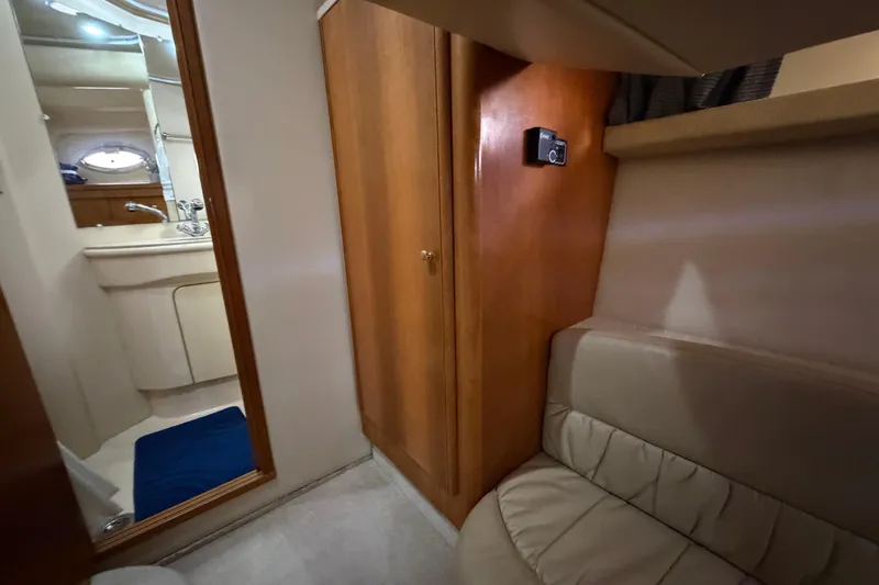 Slide: The Image of Interior of a 2004 Meridian 411 Sedan yacht, featuring a cozy cabin and bathroom. - 27