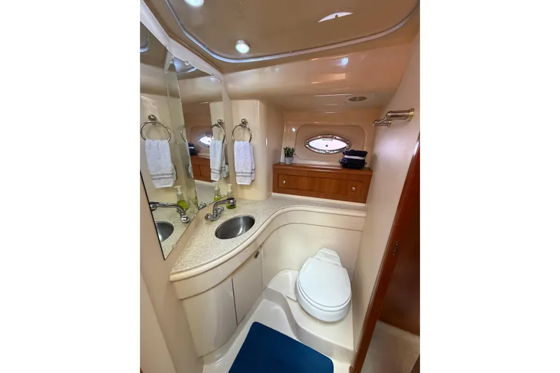 Slide: The Image of Luxurious bathroom in 2004 Meridian 411 Sedan yacht with modern fixtures and elegant design. - 28
