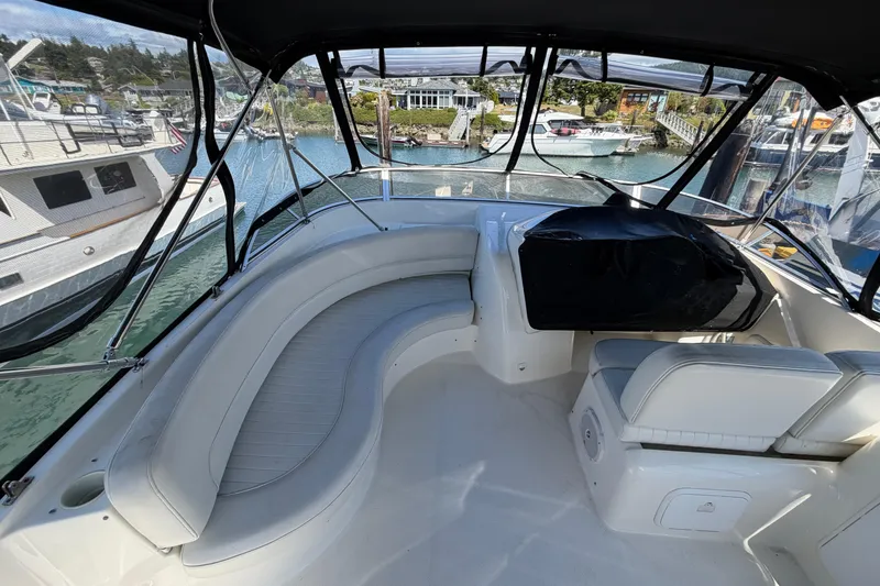 Slide: The Image of 2004 Meridian 411 Sedan yacht interior with spacious seating and marina view. - 31