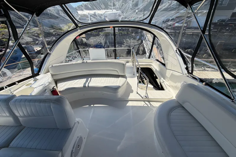 Slide: The Image of 2004 Meridian 411 Sedan yacht interior with white seating and panoramic windows. - 32