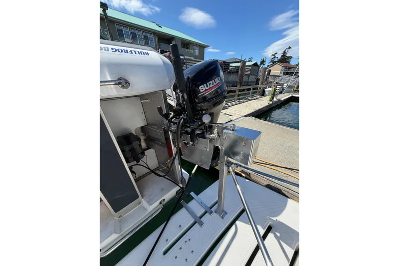 Slide: The Image of Outboard motor on a 2004 Meridian 411 Sedan yacht docked at a marina. - 36