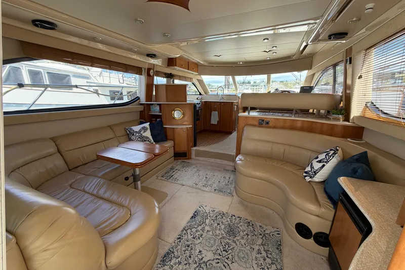 Slide: The Image of Luxurious interior of a 2004 Meridian 411 Sedan yacht with leather seating and wood accents. - 4