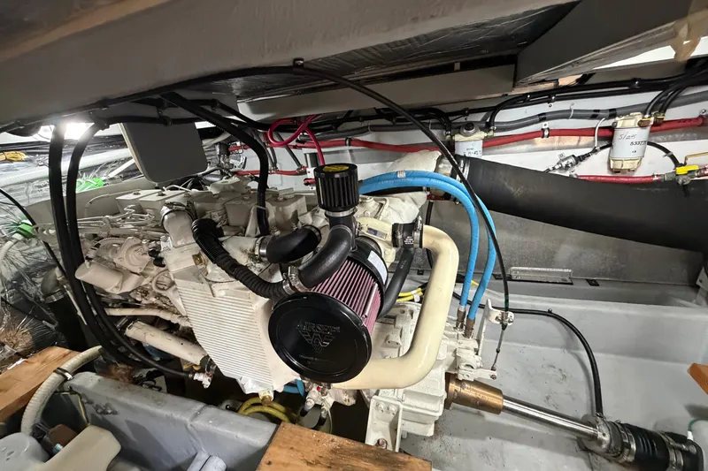 Slide: The Image of Engine room of a 2004 Meridian 411 Sedan, showcasing detailed mechanical components. - 44