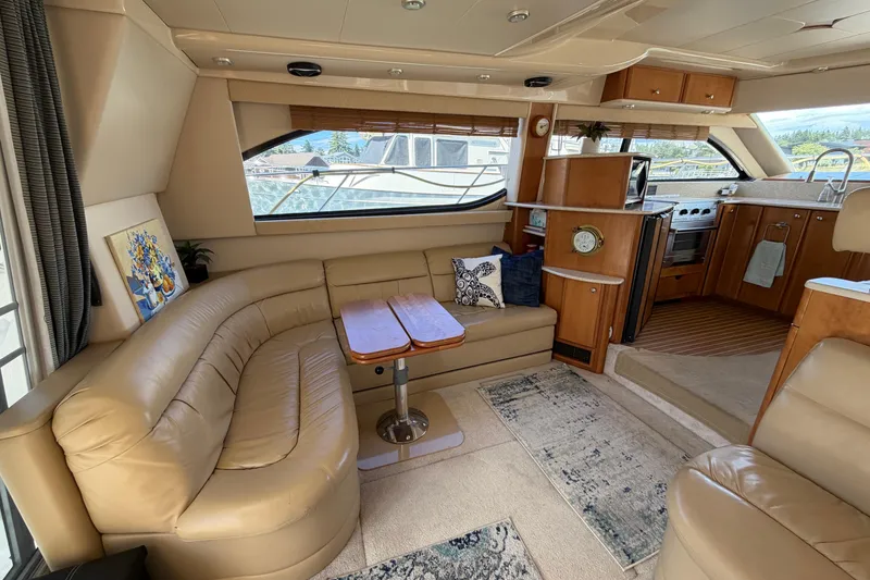 Slide: The Image of Luxurious interior of a 2004 Meridian 411 Sedan yacht with leather seating and modern kitchen. - 5