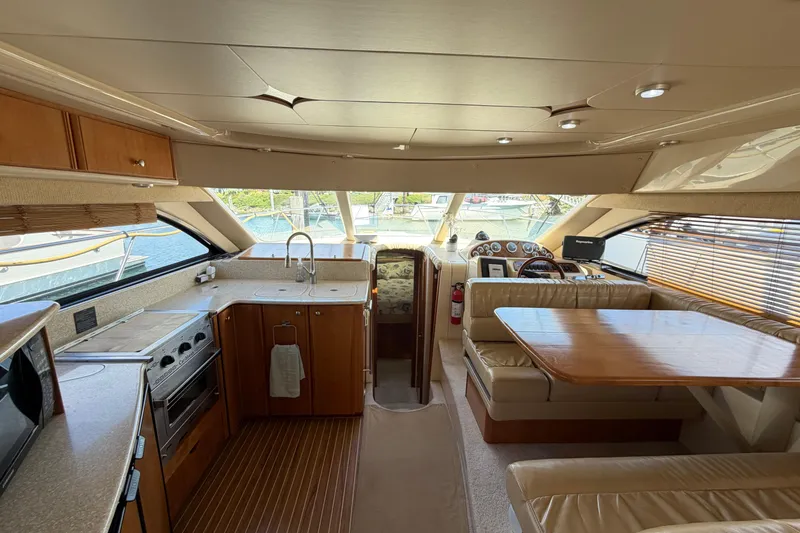 Slide: The Image of Interior of a 2004 Meridian 411 Sedan yacht with kitchen and dining area. - 6