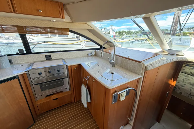 Slide: The Image of Interior of 2004 Meridian 411 Sedan yacht kitchen with stove and sink. - 8