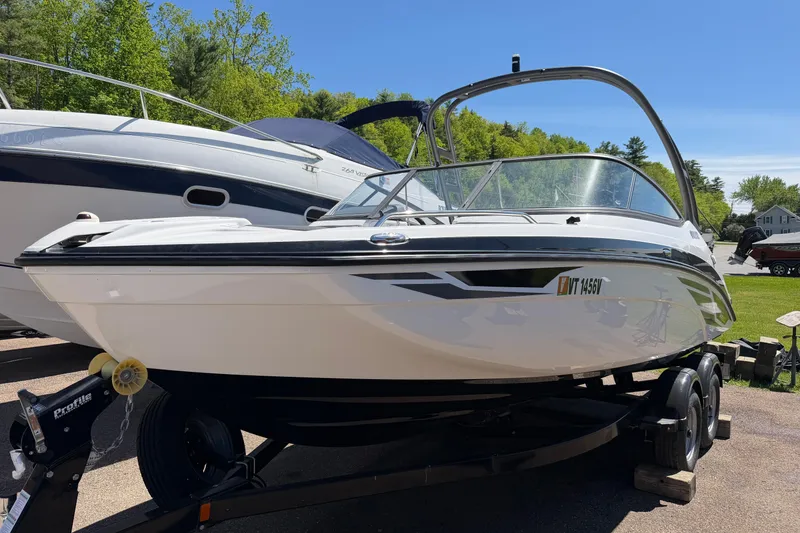 Slide: The Image of 2018 Yamaha Boats AR210 on trailer, parked outdoors on a sunny day. - 1
