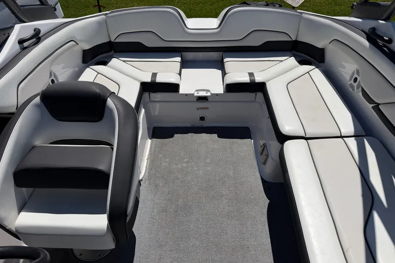 Slide: The Image of 2018 Yamaha Boats AR210 interior with spacious seating and modern design. - 12