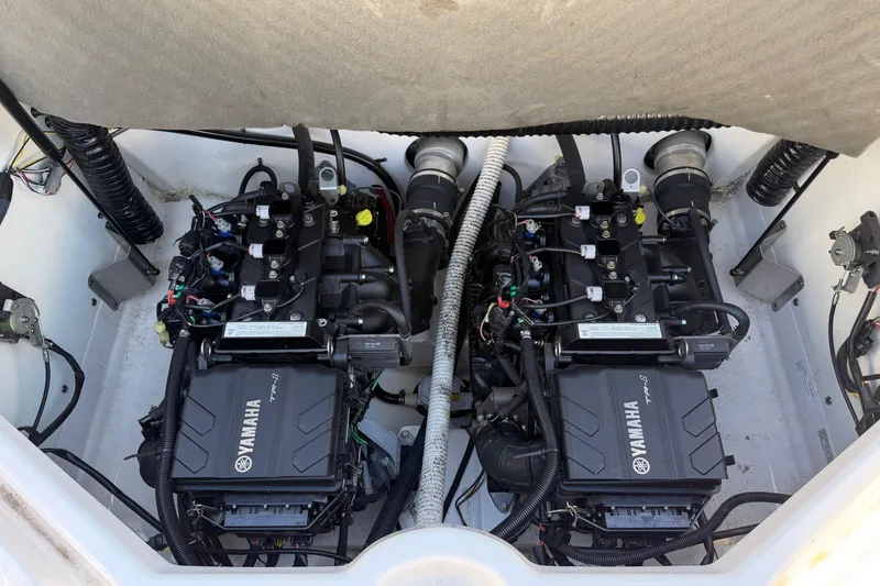 Slide: The Image of 2018 Yamaha AR210 boat engine compartment with dual engines. - 13