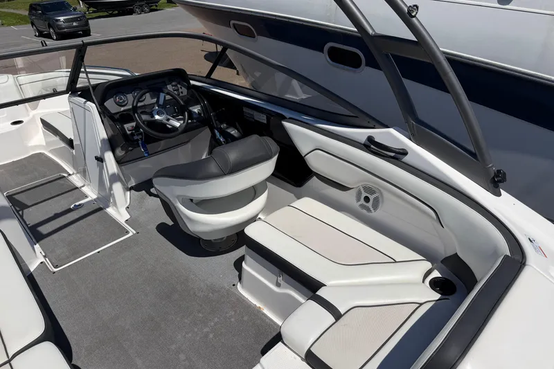 Slide: The Image of 2018 Yamaha Boats AR210 interior with steering wheel, seating, and dashboard. - 5