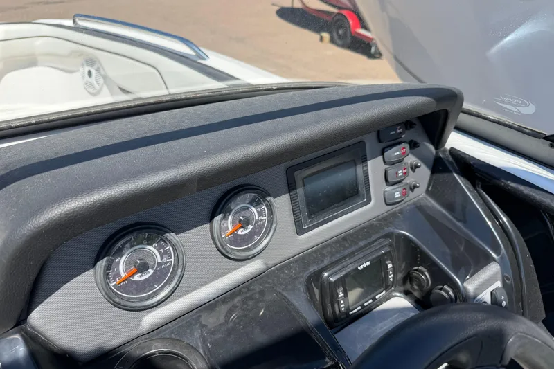 Slide: The Image of Dashboard of a 2018 Yamaha Boats AR210, featuring gauges and control panel. - 8