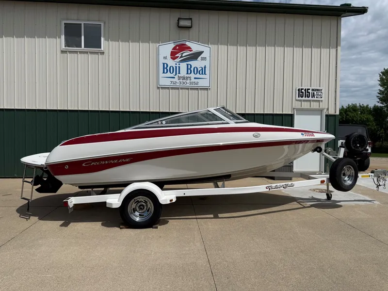 The Image of 2010 Crownline 180 BR boat on trailer outside Boji Boat building. - 0