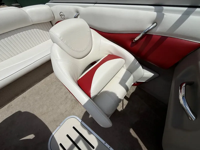 Slide: The Image of Interior of a 2010 Crownline 180 BR boat with white and red seating. - 13