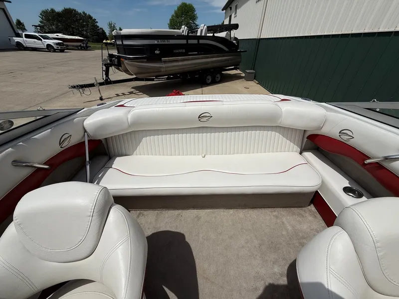 Slide: The Image of Interior of a 2010 Crownline 180 BR boat with white seating. - 14