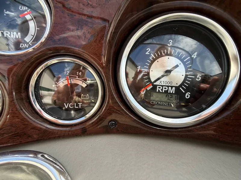 Slide: The Image of Dashboard of 2010 Crownline 180 BR with RPM and voltage gauges. - 15