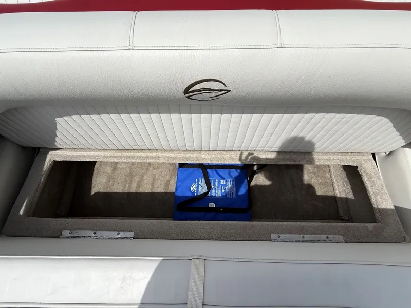 Slide: The Image of Crownline 180 BR 2010 boat seat with storage compartment. - 18