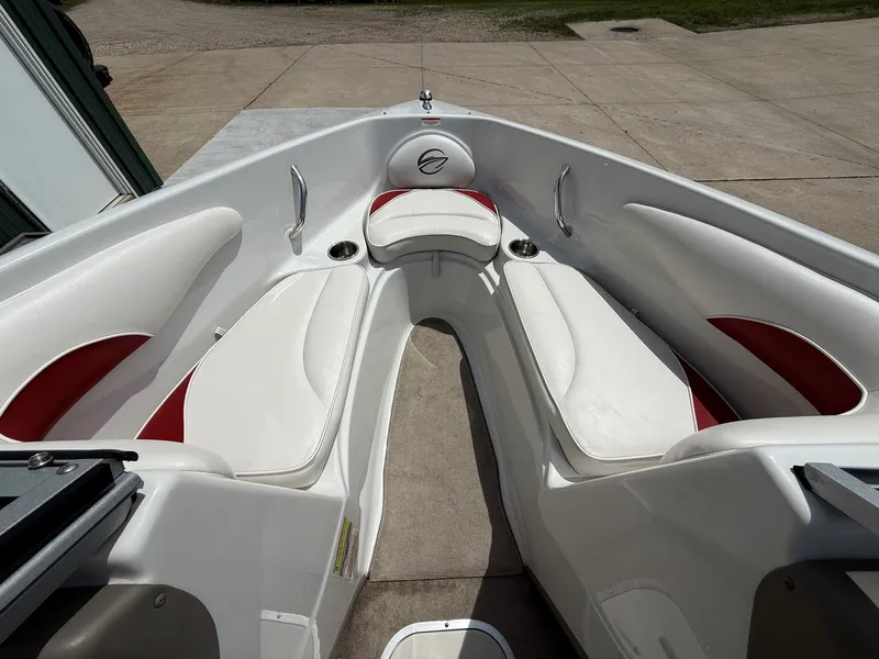 Slide: The Image of Interior of a 2010 Crownline 180 BR boat with white seating. - 9