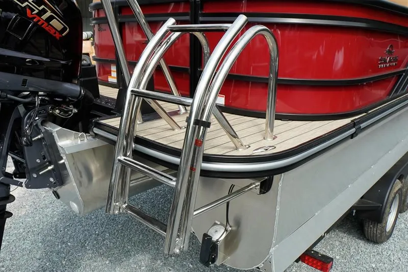 Slide: The Image of Rear view of 2026 SunCatcher Fusion 324RC boat with ladder and outboard motor. - 10