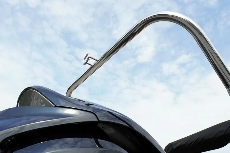 Slide: The Image of Close-up of SunCatcher Fusion 324RC boat detail against a blue sky, 2026 model. - 11