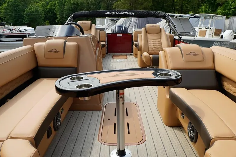 Slide: The Image of Luxurious interior of 2026 SunCatcher Fusion 324RC pontoon boat with plush seating and table. - 15