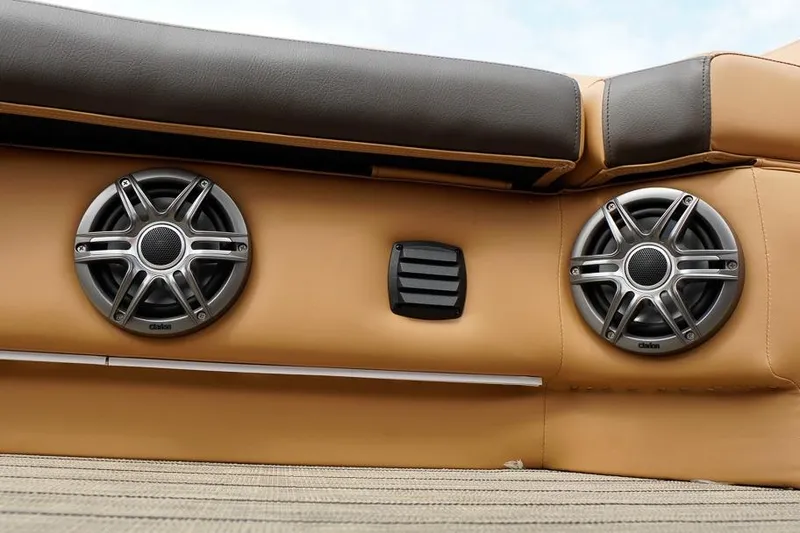 Slide: The Image of Speakers on SunCatcher Fusion 324RC boat, 2026 model, with tan upholstery. - 20