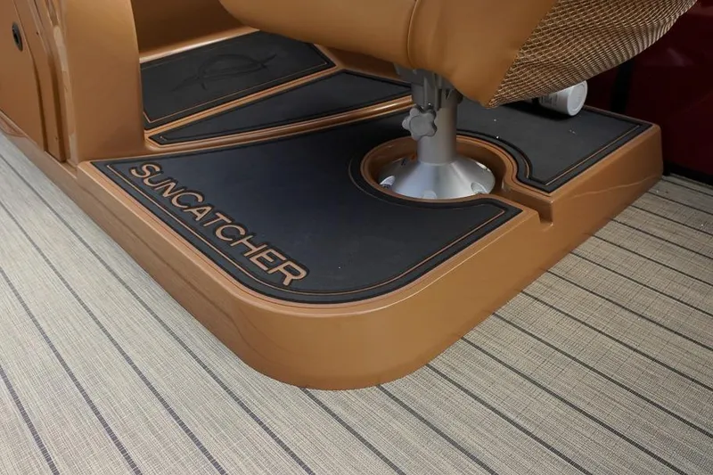 Slide: The Image of 2026 SunCatcher Fusion 324RC boat interior with branded flooring and seating. - 22