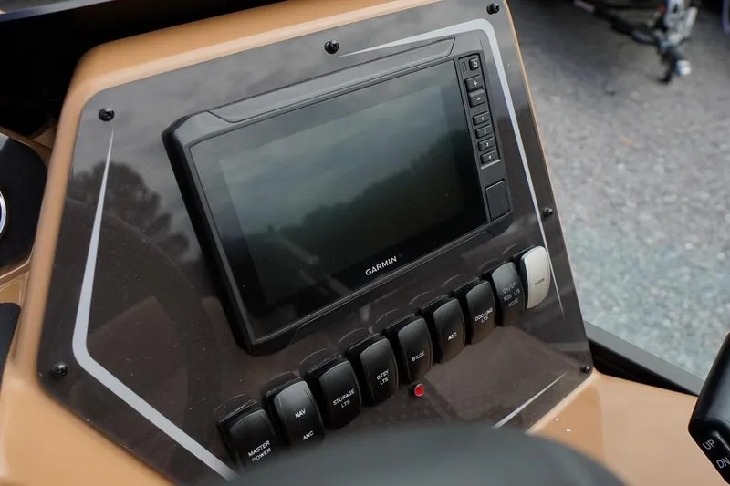 Slide: The Image of Control panel of 2026 SunCatcher Fusion 324RC with Garmin display and switches. - 27