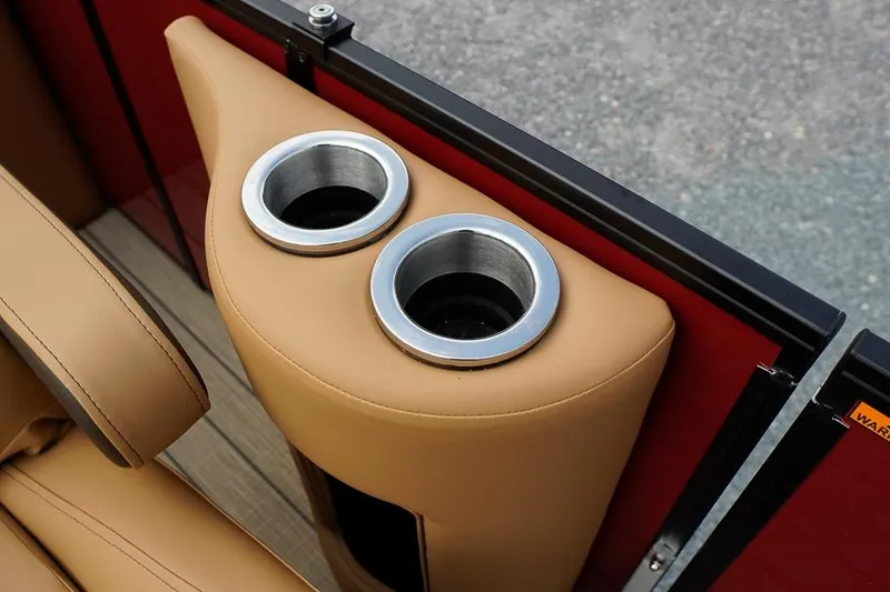 Slide: The Image of Luxury cup holders in tan leather interior of 2026 SunCatcher Fusion 324RC boat. - 29