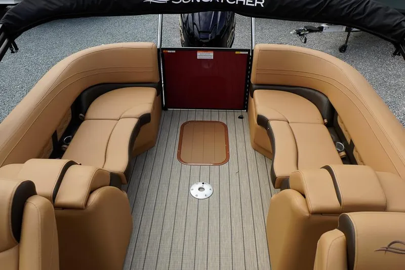 Slide: The Image of Luxurious interior of 2026 SunCatcher Fusion 324RC pontoon boat with tan seating. - 30