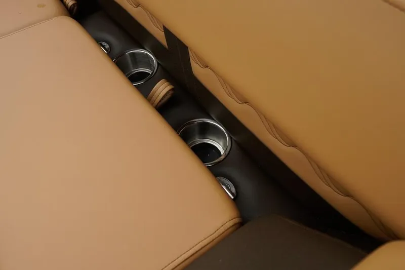 Slide: The Image of Tan leather seats with integrated cup holders in SunCatcher Fusion 324RC, 2026 model. - 33