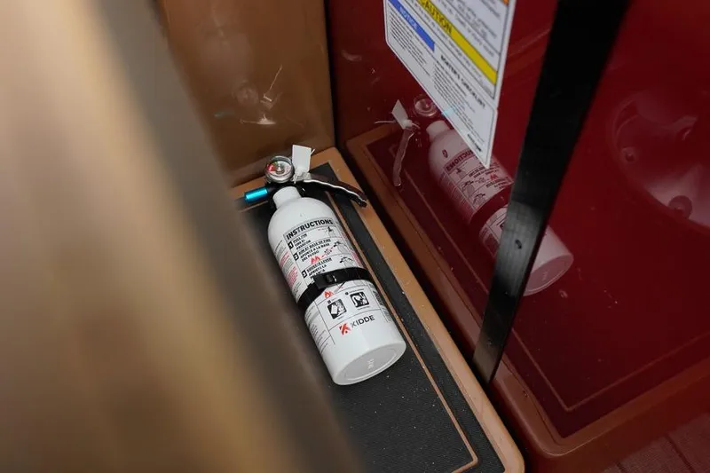 Slide: The Image of Fire extinguisher in SunCatcher Fusion 324RC, 2026 model, safety equipment detail. - 34