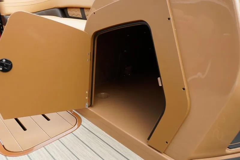 Slide: The Image of Open storage compartment on 2026 SunCatcher Fusion 324RC boat, showcasing interior space. - 36
