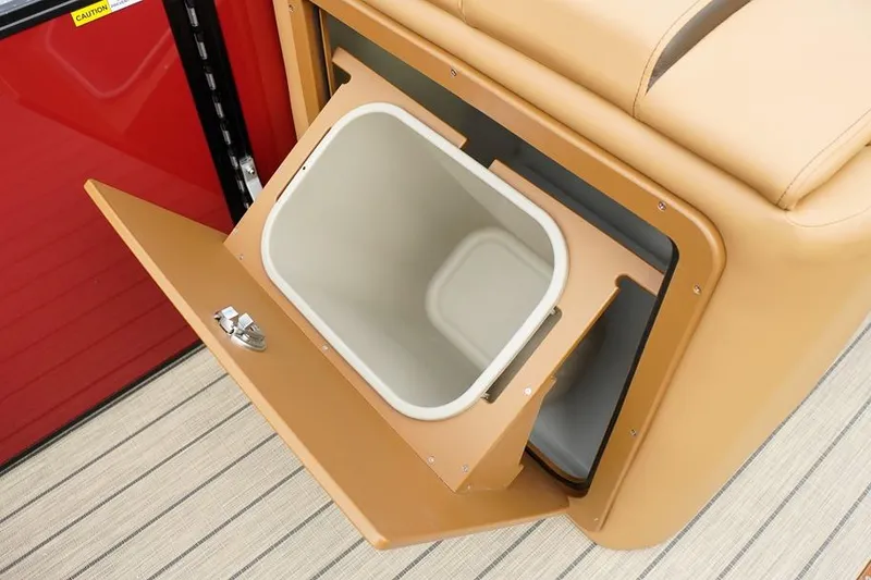 Slide: The Image of Built-in storage compartment on 2026 SunCatcher Fusion 324RC boat, featuring a removable bin. - 37
