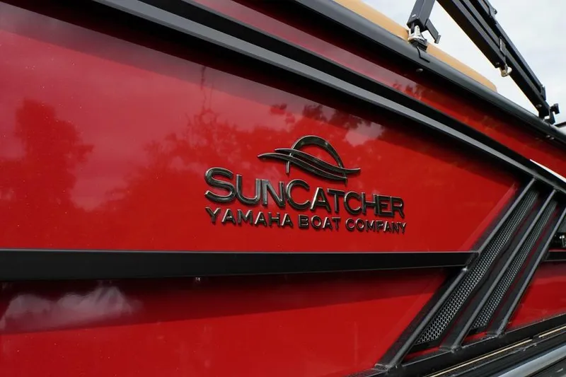 Slide: The Image of Red SunCatcher Fusion 324RC boat, Yamaha Boat Company logo, 2026 model. - 7