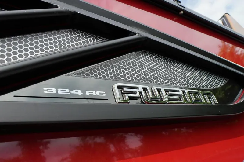Slide: The Image of Close-up of 2026 SunCatcher Fusion 324RC logo on a red vehicle. - 8