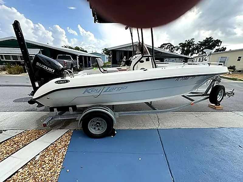Slide: The Image of 2024 Caravelle Key Largo 1800 CC boat on trailer, Suzuki engine. - 2