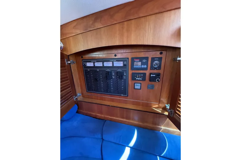 Slide: The Image of Electrical panel inside 2006 Sabre 38 Salon Express yacht with wooden finish. - 26