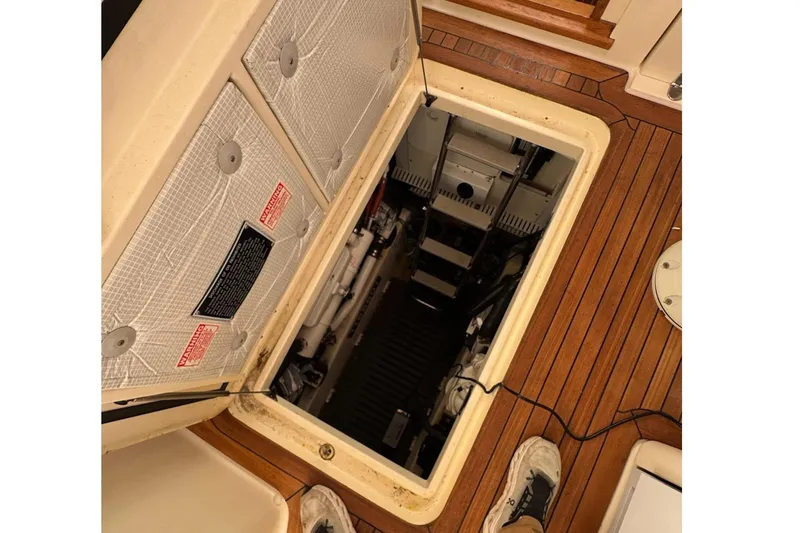 Slide: The Image of Engine compartment of 2006 Sabre 38 Salon Express with open hatch on teak deck. - 29