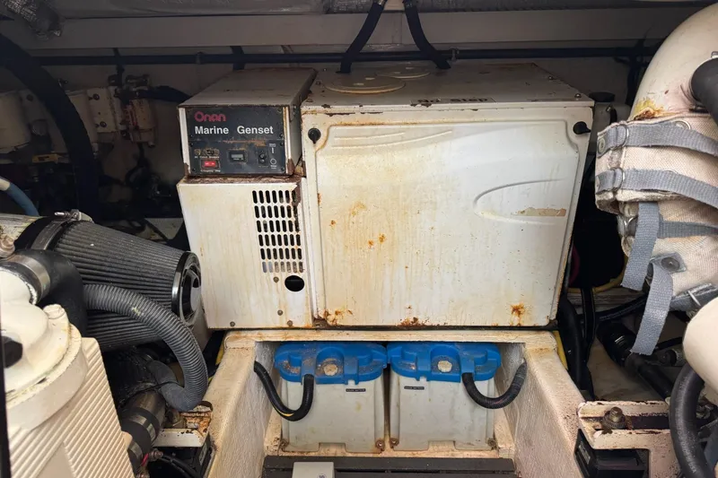 Slide: The Image of Engine room of 2006 Sabre 38 Salon Express with Onan Marine Genset and batteries. - 30