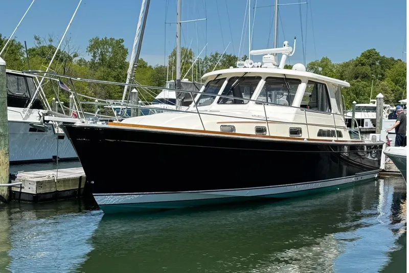 Slide: The Image of 2006 Sabre 38 Salon Express yacht docked in a marina on a sunny day. - 32