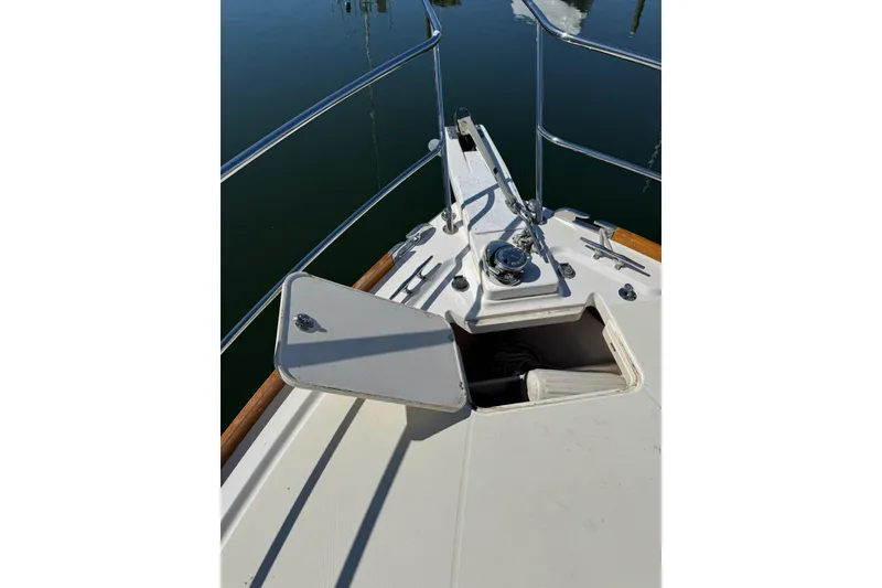 Slide: The Image of Bow deck of 2006 Sabre 38 Salon Express with open hatch and railing. - 8