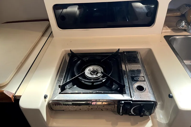 Slide: The Image of Compact stove in 2005 Albin 28 Tournament Express boat kitchen area. - 10