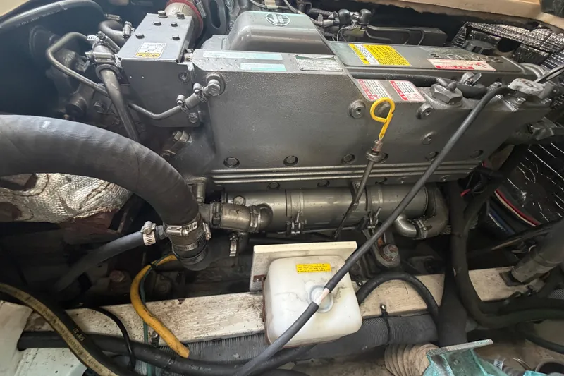 Slide: The Image of Engine compartment of a 2005 Albin 28 Tournament Express boat, showing detailed components. - 18
