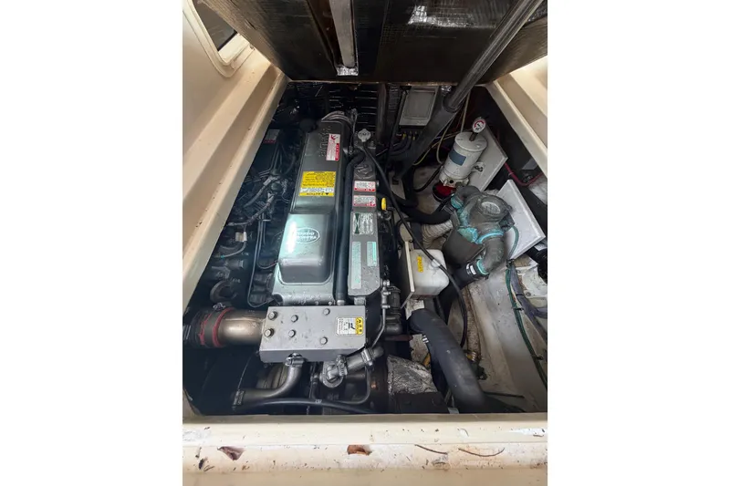 Slide: The Image of Engine compartment of a 2005 Albin 28 Tournament Express boat, showcasing mechanical components. - 19