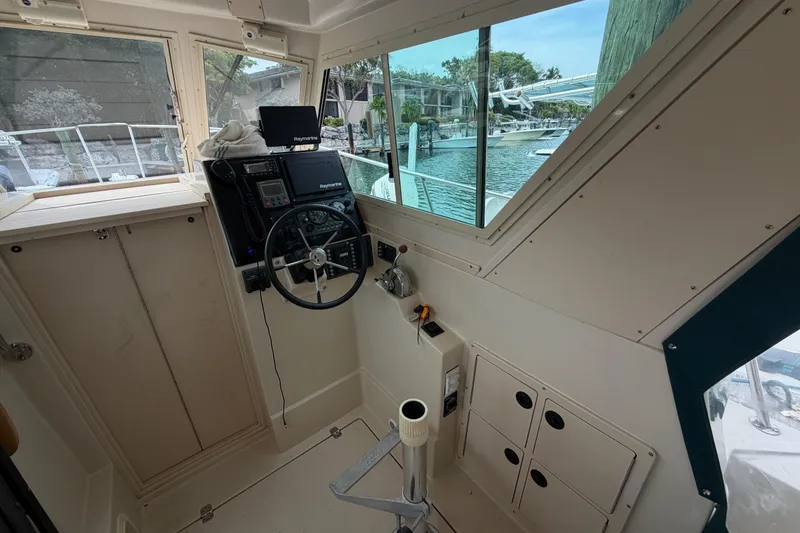 Slide: The Image of Interior helm of 2005 Albin 28 Tournament Express boat with steering wheel and navigation equipment. - 20