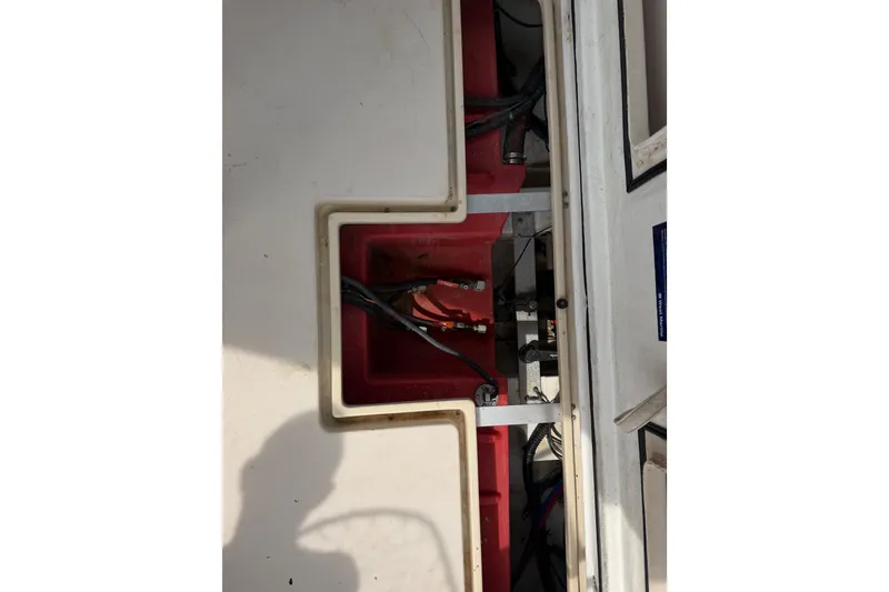 Slide: The Image of Engine compartment of a 2005 Albin 28 Tournament Express boat, showing wiring and components. - 21
