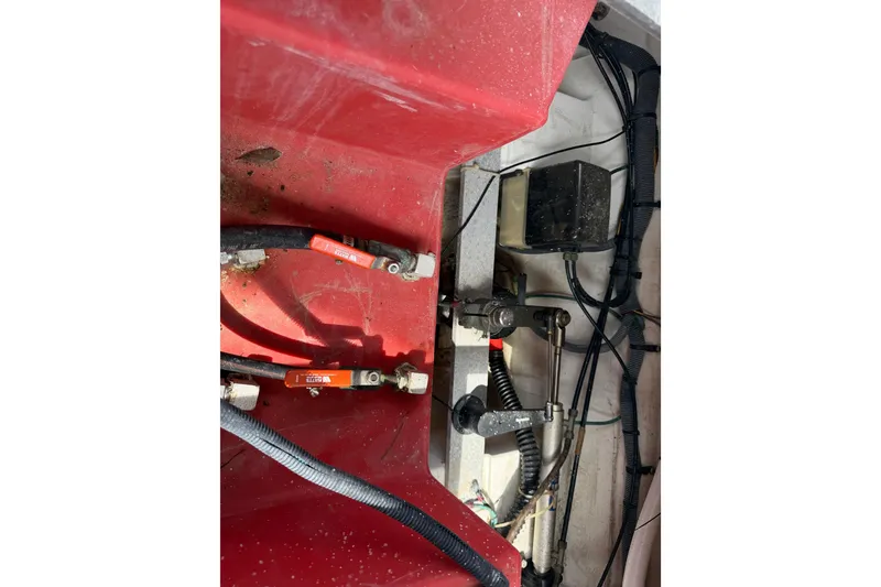 Slide: The Image of Engine compartment of a 2005 Albin 28 Tournament Express with visible wiring and components. - 22