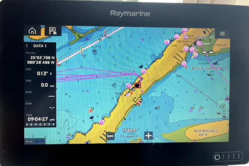 Slide: The Image of Raymarine navigation display showing nautical chart near Rock Harbor, coordinates 25°03.788'N, 80°28.488'W. - 27