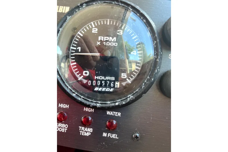 Slide: The Image of Close-up of Albin 28 Tournament Express 2005 tachometer showing 576 hours. - 31