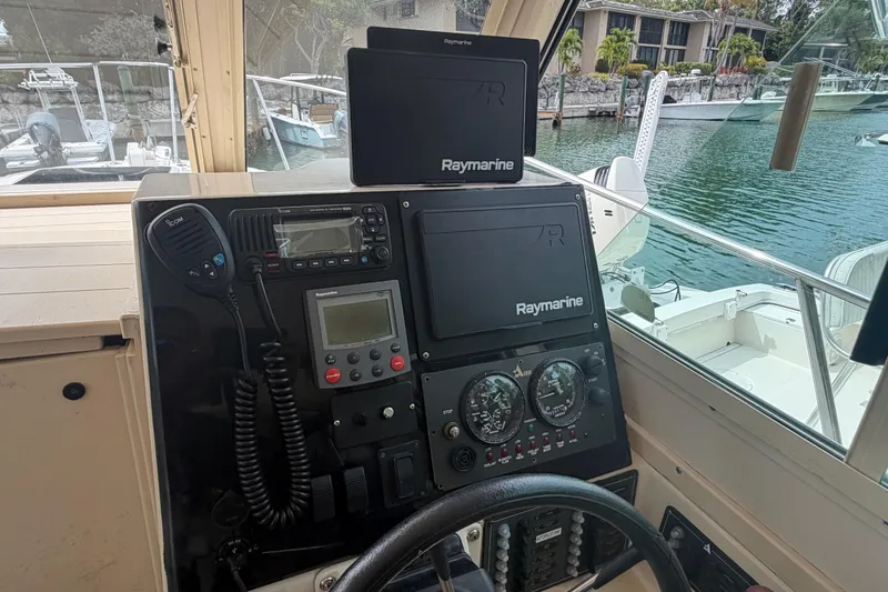 Slide: The Image of Helm of 2005 Albin 28 Tournament Express with Raymarine electronics and Icom radio. - 5